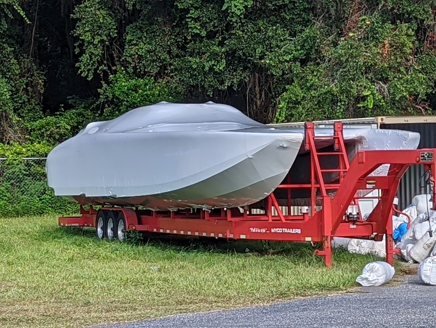 Boat shrink wrap on transport trailer